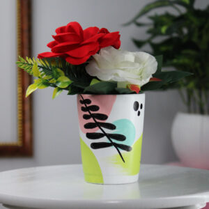 Rusticworld ke handmade clay pot me rakhe hue beautiful artificial flowers jo natural look dete hain aur ghar ke decor ko elegant touch dete hain. Ye ecofriendly aur long-lasting design daily decoration ke liye ideal hai.